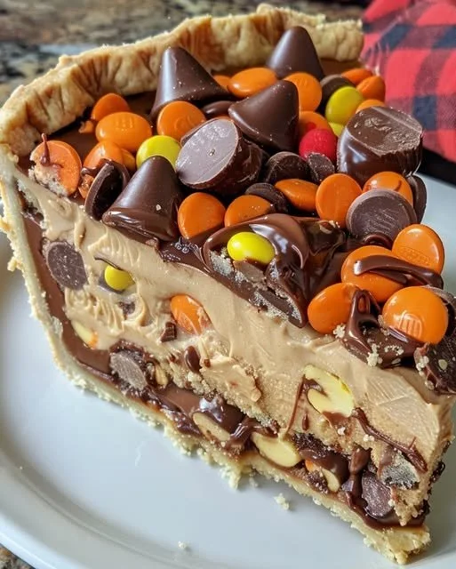 Colossal Reese's Peanut Butter Cup Pie topped with chocolate and peanut butter layers