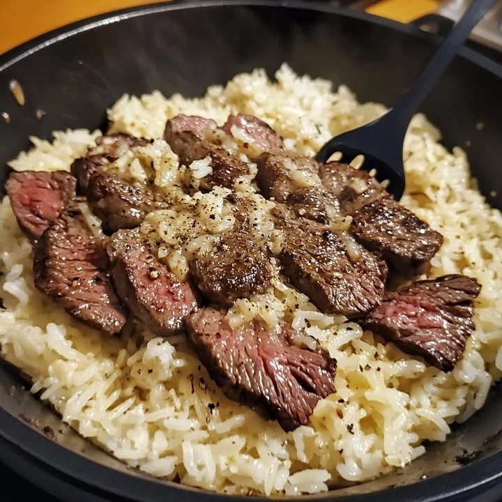 Delicious One-Pan Garlic Butter Steak with Rice served on a plate.